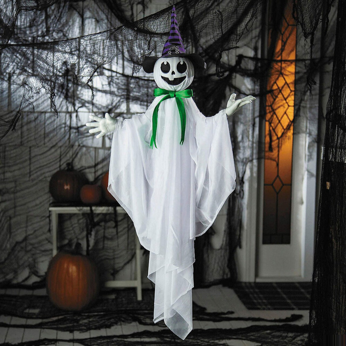 39 1/4" Animated Hanging Smiling Ghost with Witch Hat and Green Bow Halloween Decoration