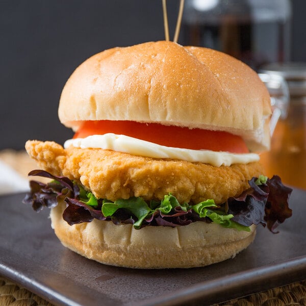Brakebush Tender-Licious 4.5 lb. Bag 6 oz. Fully Cooked Breaded Chicken Breast Fillets - 2/Case