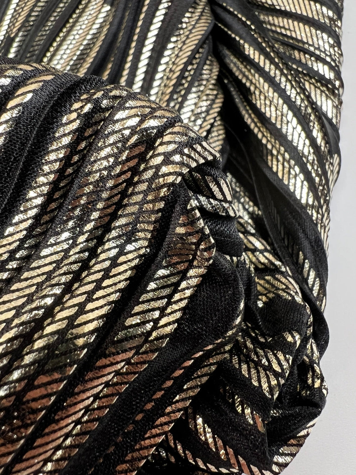Polyester Elastane Plissé Fabric in Golden Black