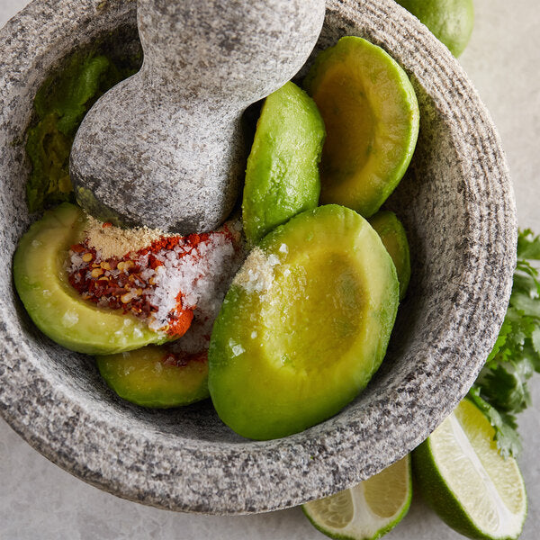 Wholly Guacamole IQF Individually Wrapped Hass Avocado Halves 1.5 oz. - 64/Case