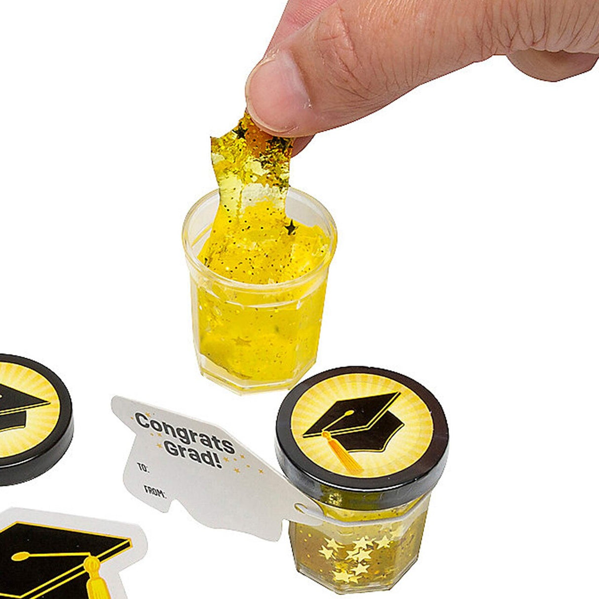 Bulk 48 Pc. Mini Gold Star Glitter Putty with Graduation Cap Card