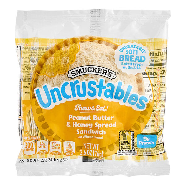 Smucker's Uncrustables Honey and Peanut Butter Whole Wheat Sandwich 2.6 oz. - 72/Case