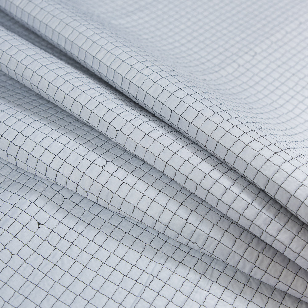 Black and White Reversible Quilted Coating with Filler