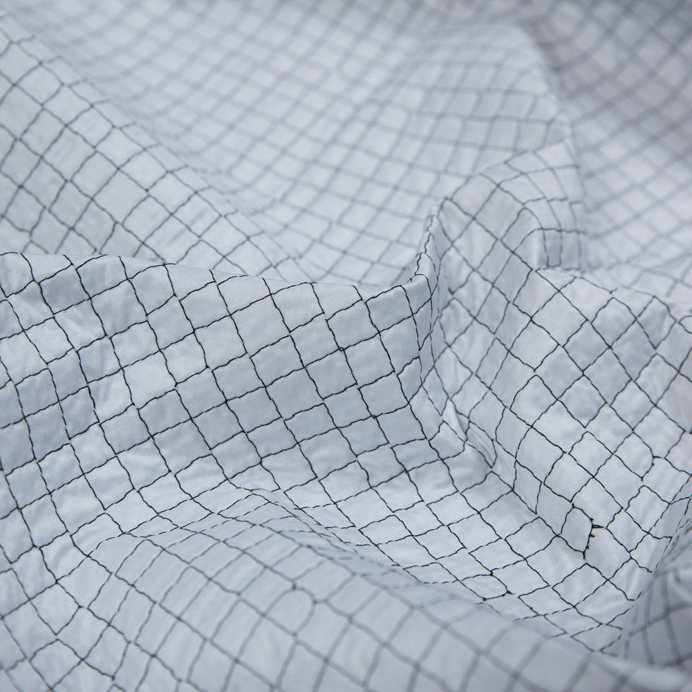 Black and White Reversible Quilted Coating with Filler