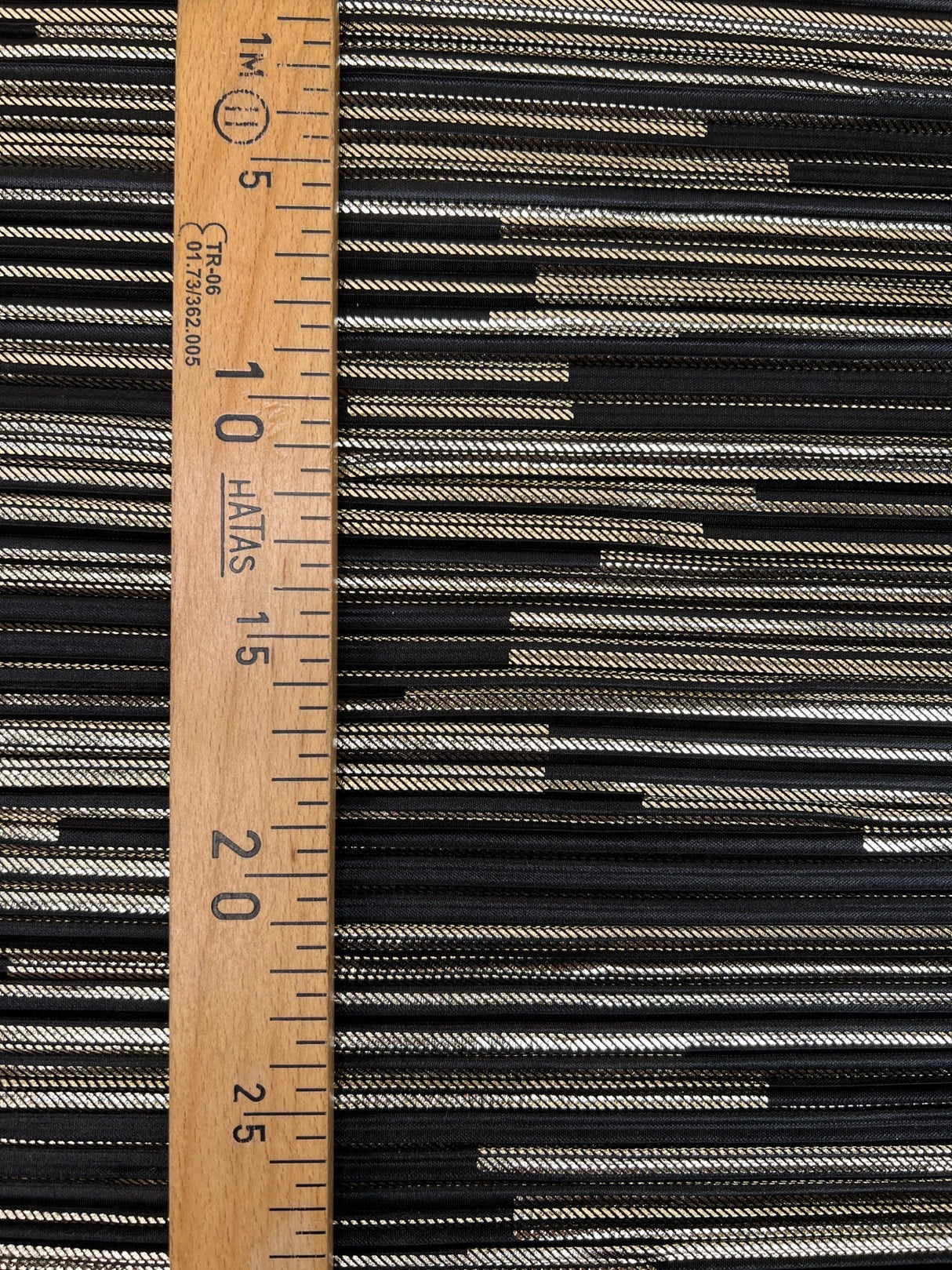 Polyester Elastane Plissé Fabric in Golden Black