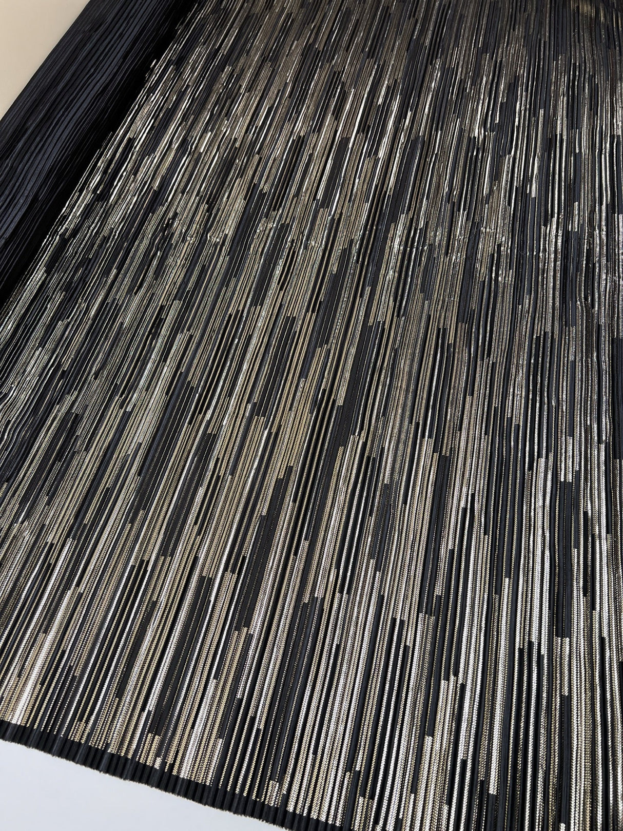 Polyester Elastane Plissé Fabric in Golden Black