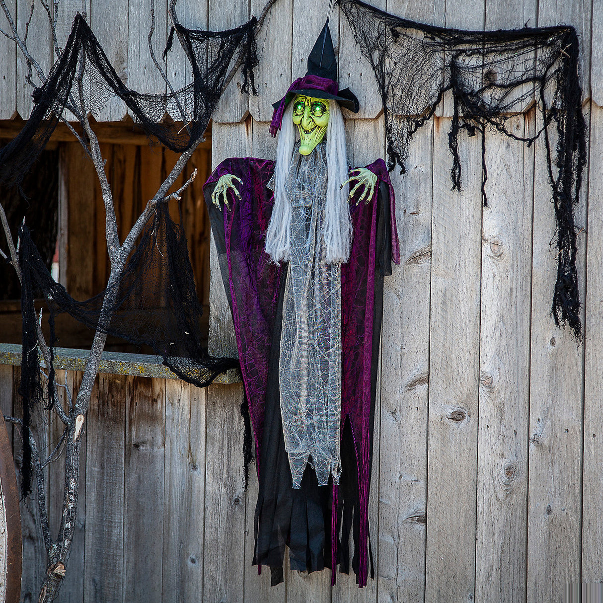 Spooky Hanging Animated Witch with Green Eyes for Halloween Party Decorations and Haunted House Displays