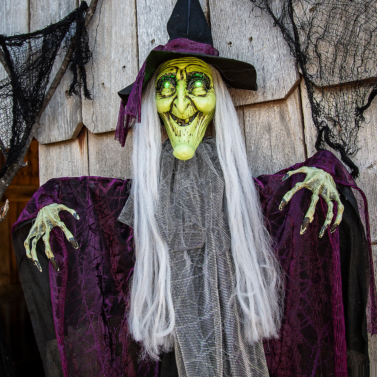 Hanging Animated Witch with Green Eyes Halloween Decoration 4 Ft.