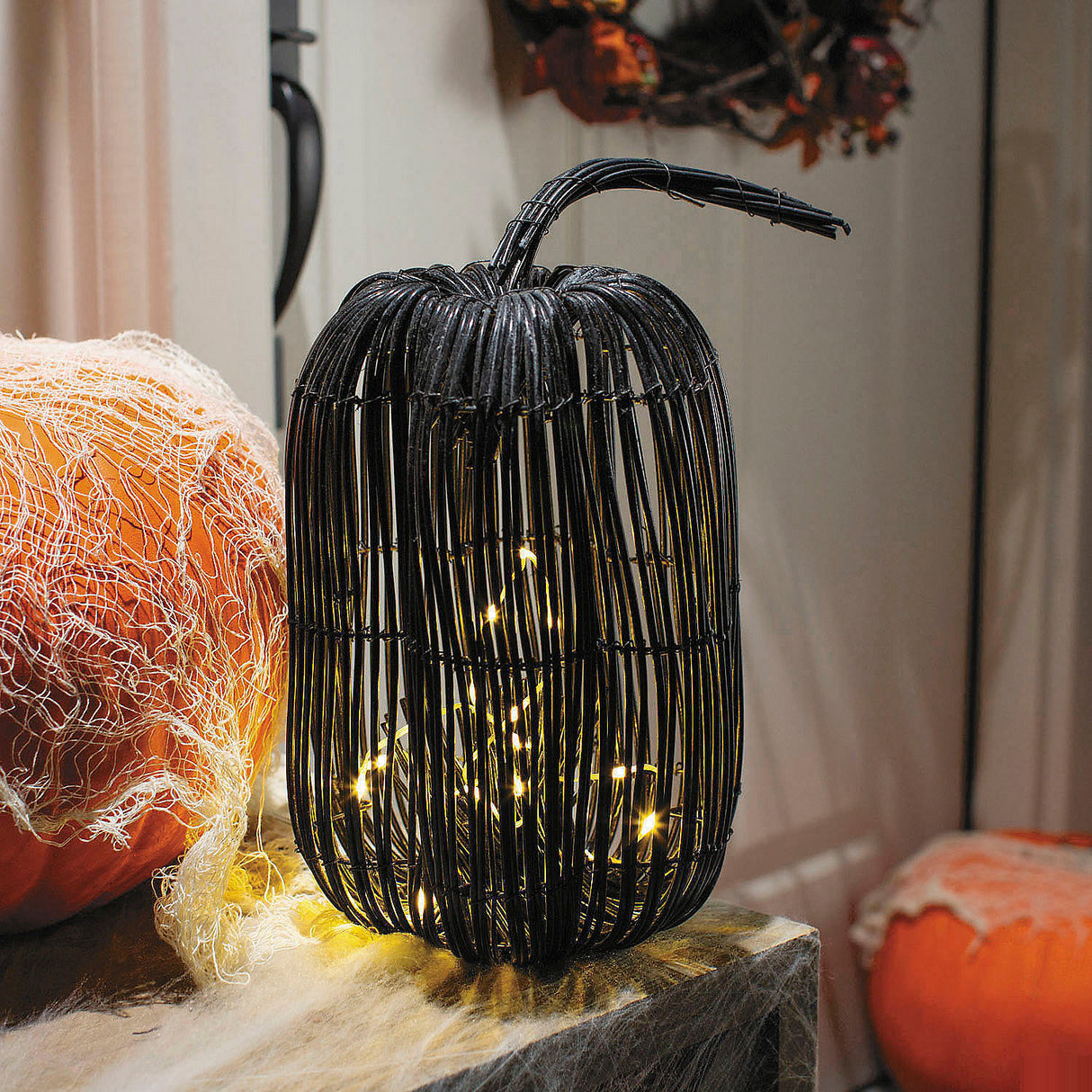 Decorative Tall Rattan Pumpkin with Yellow Light Strand for Halloween Events and Festive Displays