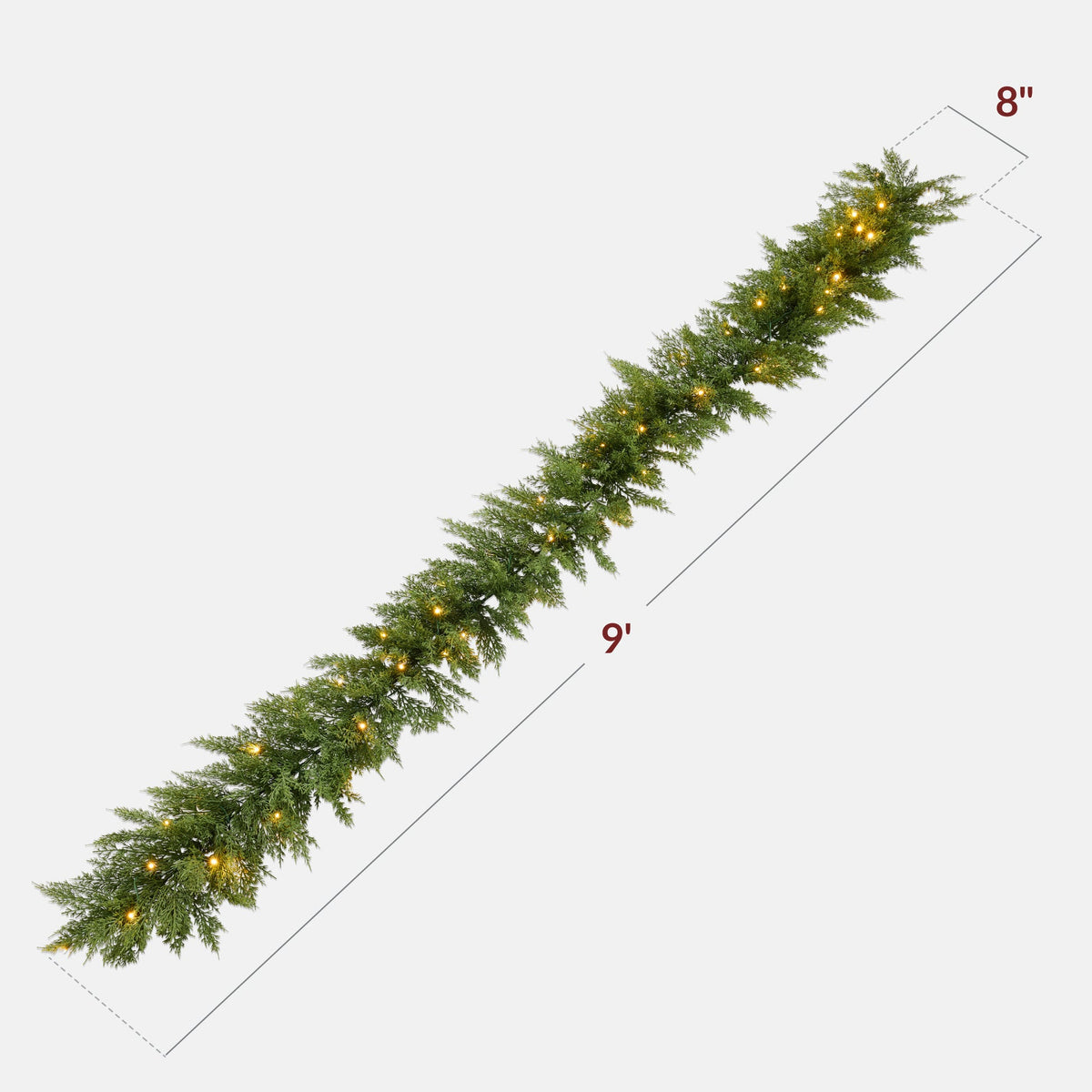 Pre-lit cedar cypress Christmas garland with twinkling LED lights draped over a mantel