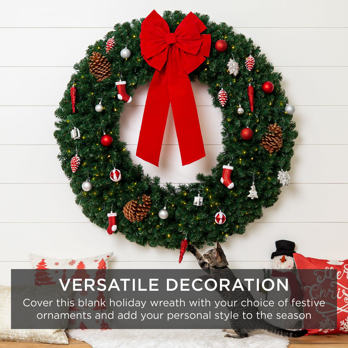 Plug-in pre-lit artificial fir Christmas wreath glowing with LED lights hung on a front door