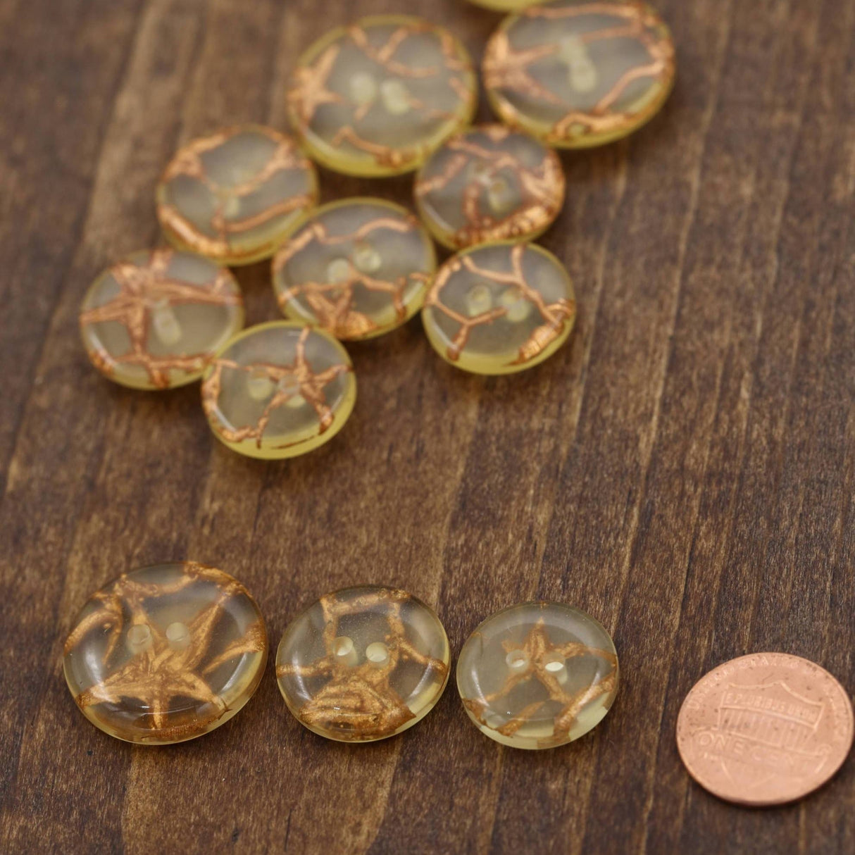 Clear Plastic Button with Gold Artistic Working