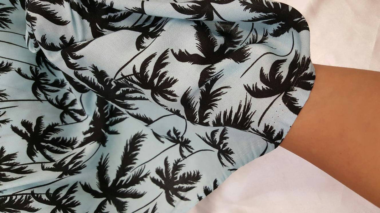 Rayon Challis Black Palm Tree on Baby Blue Background