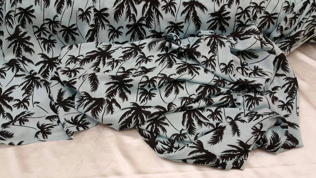Rayon Challis Black Palm Tree on Baby Blue Background