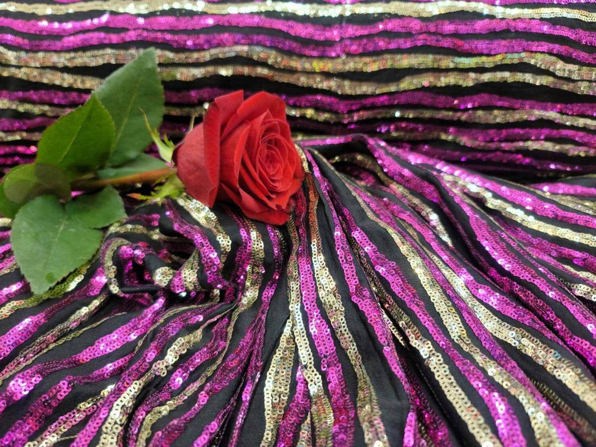 Sequin Fabric on Black Jersey Knit Gold and Fuchsia