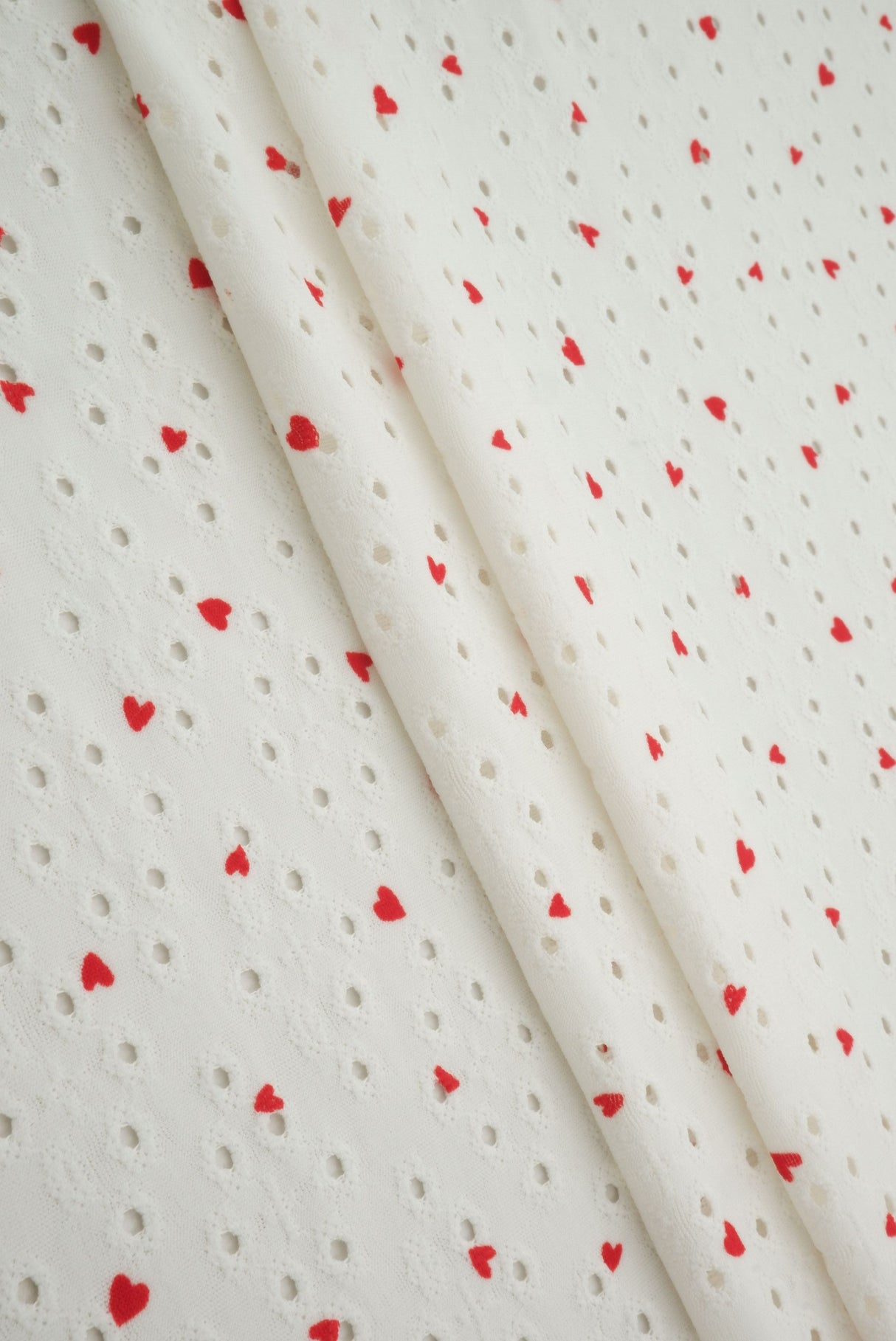 Heart Print Jacquard Eyelet Knit Fabric