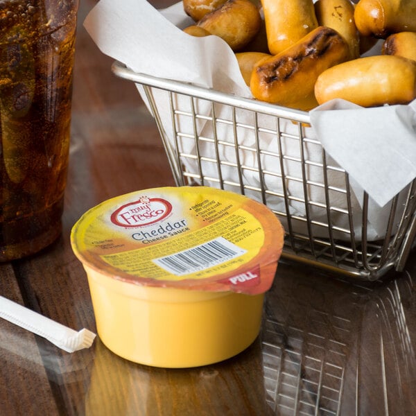 Muy Fresco 3.8 oz. Microwavable Cheddar Cheese Sauce Cup - 30/Case