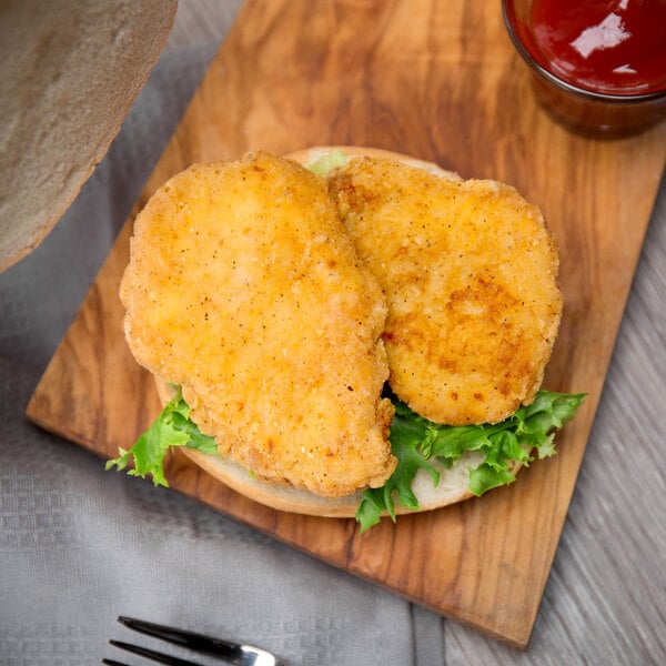 Brakebush Country Style 10 lb. Case 2 oz. Breaded Chicken Breast Sliders
