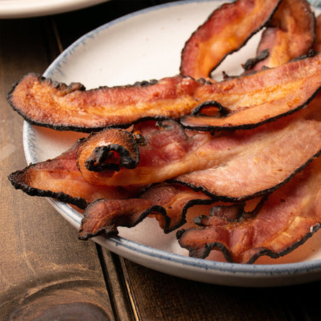 Kunzler 10-12 Count Thick Black Forest Hardwood Smoked Sliced Bacon 5 lb. - 2/Case