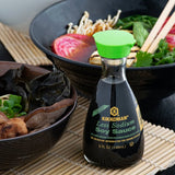 Kikkoman Traditionally Brewed Less Sodium Soy Sauce Bottle 5 fl. oz. - 12/Case