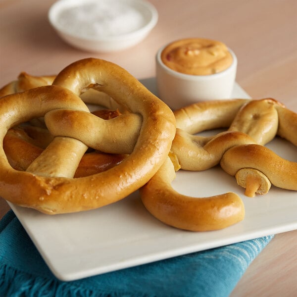 SuperPretzel Cheddar Cheese Stuffed Soft Pretzel 5 oz. - 50/Case