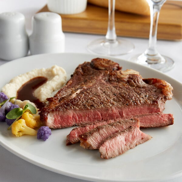 Warrington Farm Meats 12 oz. Frozen T-Bone Steak - 14/Case