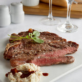 Warrington Farm Meats 12 oz. Frozen Porterhouse Steak - 14/Case