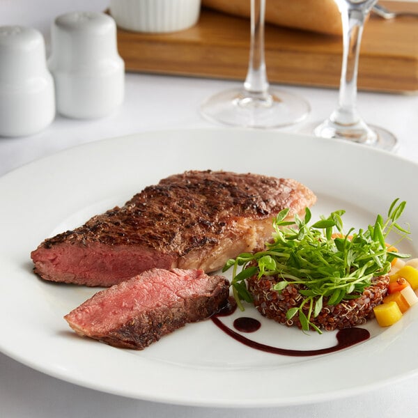 Warrington Farm Meats 8 oz. Frozen New York Strip Steak - 20/Case