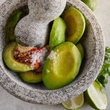 Wholly Guacamole IQF Individually Wrapped Hass Avocado Halves 1.5 oz. - 64/Case