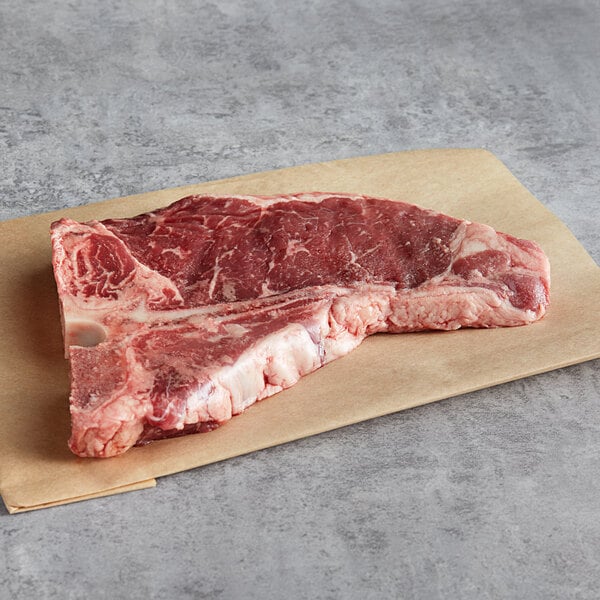 Warrington Farm Meats 12 oz. Frozen T-Bone Steak - 14/Case
