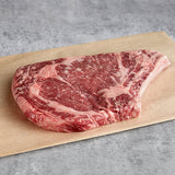 Warrington Farm Meats 14 oz. Frozen Bone-In Ribeye Steak - 12/Case