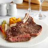 Warrington Farm Meats 14 oz. Frozen Bone-In Ribeye Steak - 12/Case