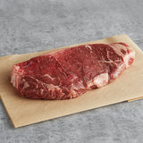 Warrington Farm Meats 8 oz. Frozen New York Strip Steak - 20/Case