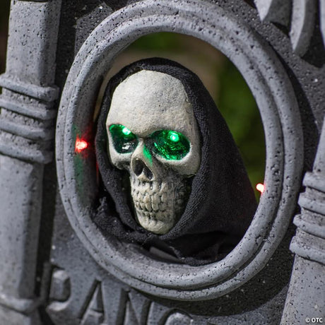 Tombstone with Light-Up Moving Skeleton Head Halloween Decoration, lights up for a spooky Halloween night display