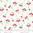 Cotton Print Jubilee White and Red Tossed Cherries Fabric