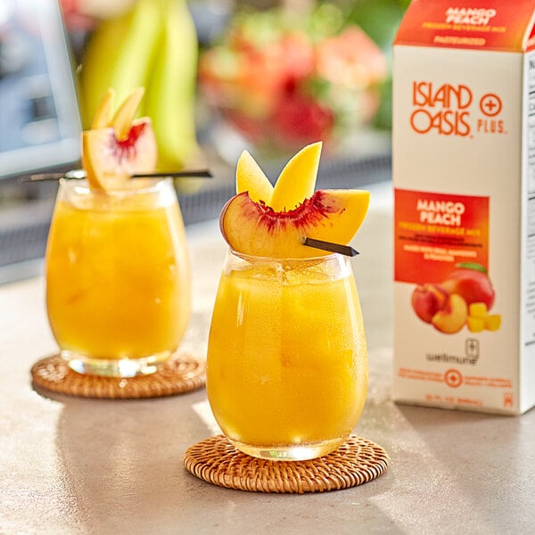 Island Oasis Plus Mango Peach Frozen Beverage Mix 32 fl. oz. - 12/Case