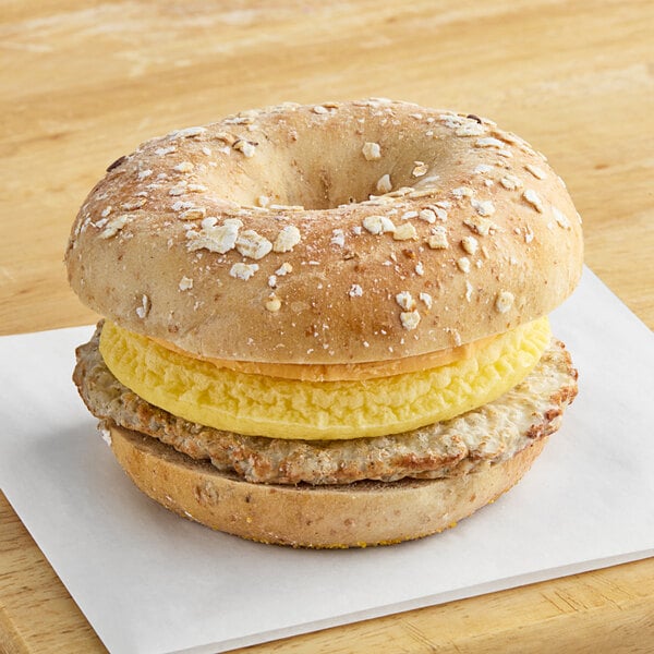 Grand Prairie Sausage, Egg, and Cheese Bagel Sandwich 5 oz. - 24/Case