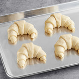 Schulstad Ready-to-Bake Large Curved Butter Croissant 3.2 oz. - 54/Case