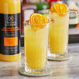 Twisted Alchemy Cold-Pressed Valencia Orange 100% Fruit Juice 25 oz. - 6/Case
