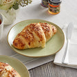 Schulstad Ready-to-Bake Almond Filled Croissant 3.3 oz. - 66/Case