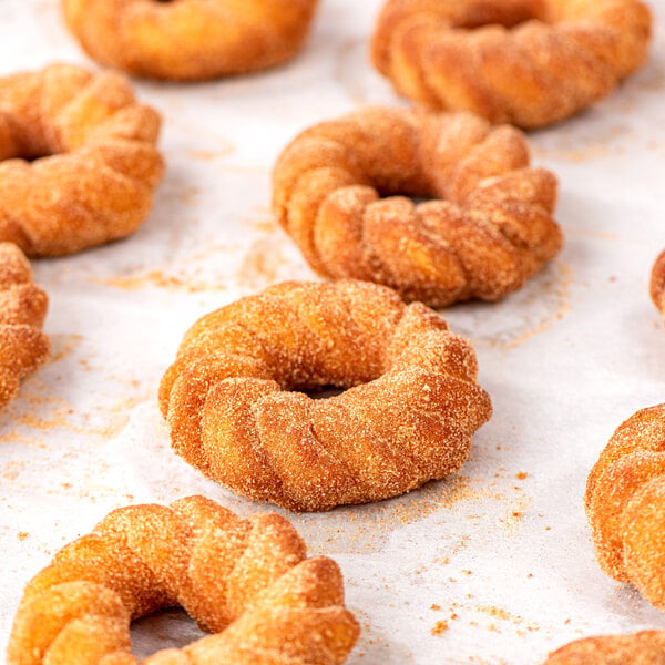 Rich's 2 oz. Ready-to-Finish Churro Donut with Cinnamon Sugar Packets - 96/Case