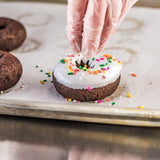 Rich's 3 oz. Ready-to-Finish Jumbo Chocolate Cake Donut - 100/Case