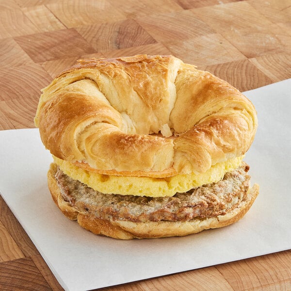 Grand Prairie Sausage, Egg, and Cheese Croissant Sandwich 5 oz. - 24/Case