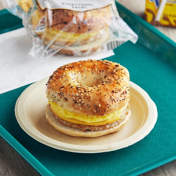 Grand Prairie Spicy Sausage, Egg, and Gouda Everything Bagel Sandwich 5.2 oz. - 24/Case