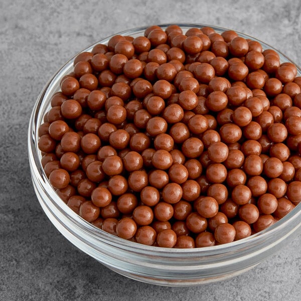 Valrhona Caramelia 36% Milk Chocolate Crunchy Pearls 6.6 lb. - 3/Case