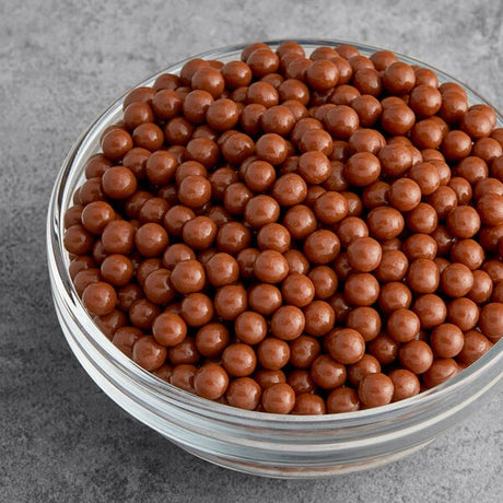 Valrhona Caramelia 36% Milk Chocolate Crunchy Pearls 6.6 lb. - 3/Case