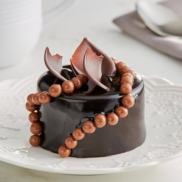 Valrhona Caramelia 36% Milk Chocolate Crunchy Pearls 6.6 lb. - 3/Case