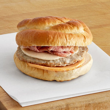 Grand Prairie Sausage, Bacon, and Cheese Pretzel Bun Sandwich 5.2 oz. - 24/Case
