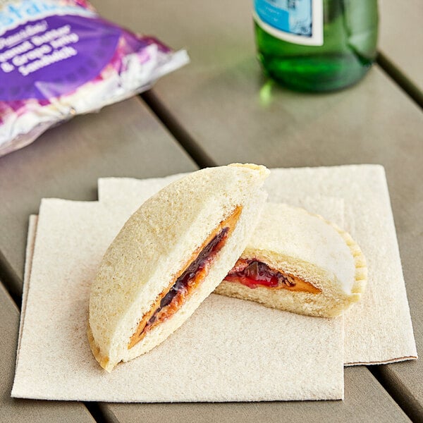 Smucker's Uncrustables Grape Jelly and Peanut Butter Sandwich 2 oz. - 60/Case