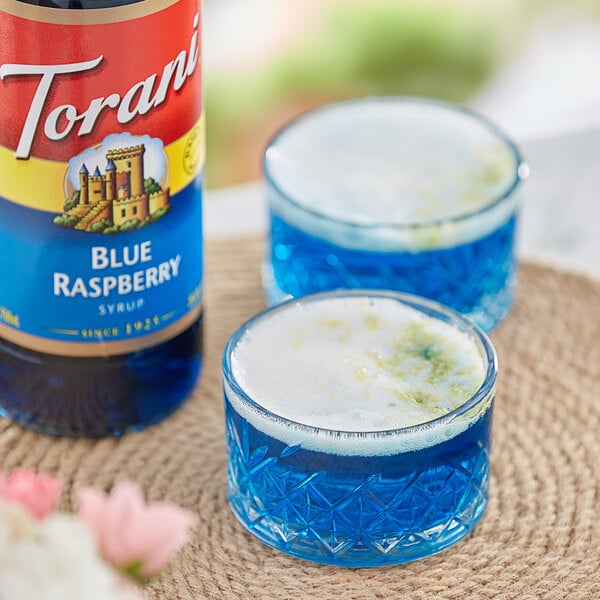 Torani Blue Raspberry Flavoring Syrup 750 mL Glass Bottle - 12/Case